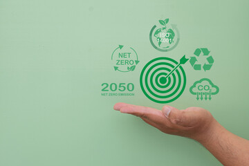Environmental goal concept.,Hand holding Dartboard  with reduce co2,net zero emission,ISO 14001...