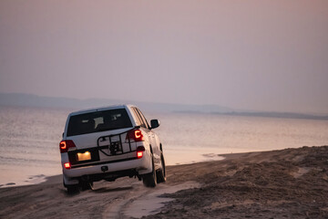 A safari tour with off-road vehicles in Doha, Qatar, where the desert sands and sea sands meet