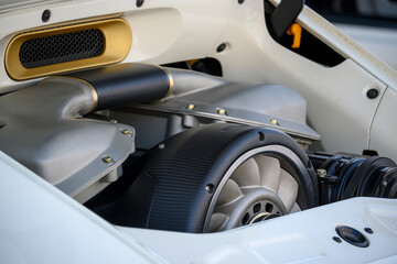 The powerful engine under the hood of the vehicle with the engine at the rear