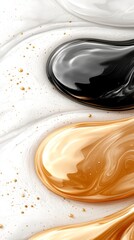 a close up of a black and gold liquid on a white surface