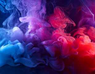 Obraz premium Dramatic smoke and fog in contrasting vivid red, blue, and purple colors. Vivid and intense abstract background or wallpaper.