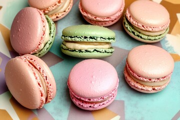Fototapeta premium Colorful macarons arranged artfully on vibrant background showca