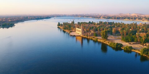 Serene view of the Nile River at sunset near a lush riverside landscape in Egypt