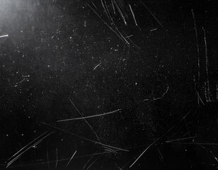 Dust and scratches on black surface. Abstract background. Texture layer for photo editor. Old grunge filter effect.
