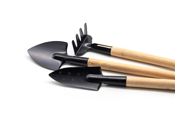 Digging Shovel Rake Spade Metal 3 pcs mini portable gardening tool set have wooden handle for succulent planter pots bonsai planting air plants indoor plants isolated on white background.