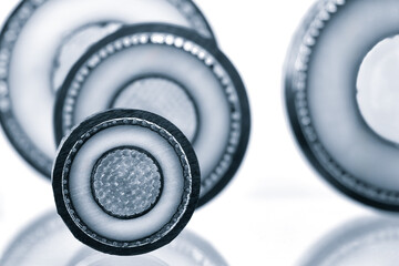 Cross section of high-voltage cable, polymer insulation. Close-up of some high voltage copper cable cross-section. Abstract focus industry concept background.