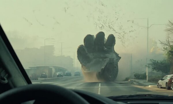 First-Person View of Giant Monster Hand Emerging From Ground