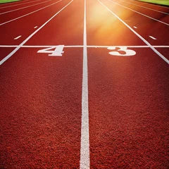 Fotobehang athletics track and field running lanes at a sport competition with artificial grass © Fazila