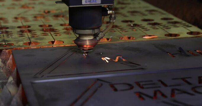 4k video of a High precision CNC laser welding metal sheet cuts a piece of metal during a demonstration. Laser cutting technology, laser welding machine industry.