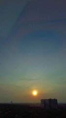 Sunrise from surabaya cityscape, from top view at office building in surabaya