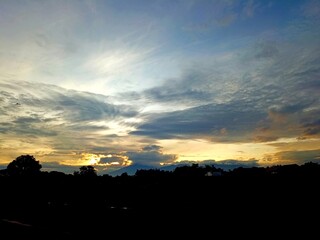 Sunrise and silhouetted mountains at the end, vibrant colorfull