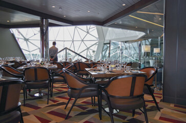 Formal and elegant Art Deco steak house speciality dining room restaurant onboard luxury cruiseship...