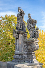 Obraz premium Statues of Saints Barbara, Margaret and Elizabeth, outdoor sculpture on Charles Bridge, Prague, Czech Republic