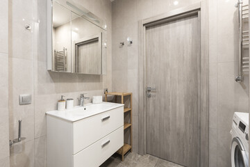 modern bathroom room with toilet and washing machine