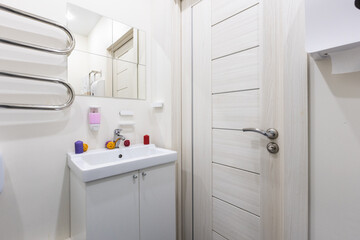 modern bathroom room with toilet and washing machine