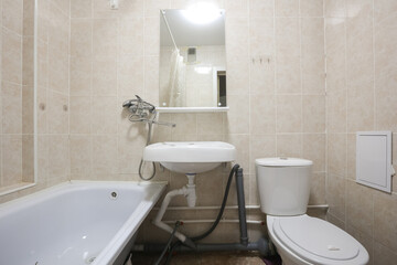 modern bathroom room with toilet and washing machine