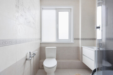 modern bathroom room with toilet and washing machine