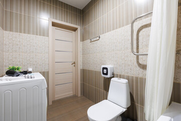 modern bathroom room with toilet and washing machine