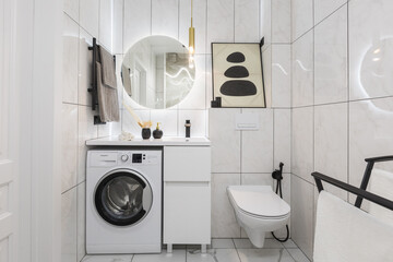 modern bathroom room with toilet and washing machine