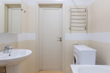 modern bathroom room with toilet and washing machine
