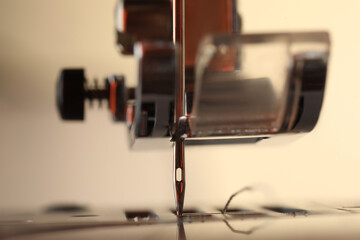 Sewing machine on light background, macro view