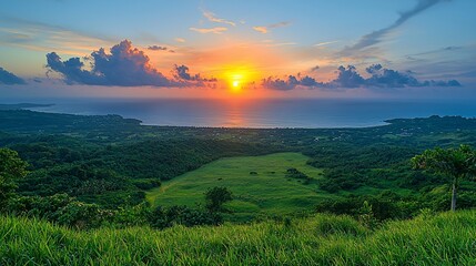 Obraz premium Vibrant sunset over coastal valley.