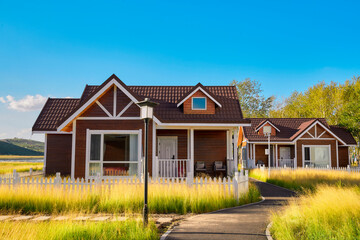 Fototapeta premium Wooden villa complex in Kulun Nao Scenic Area, Zhangjiakou, Hebei, China
