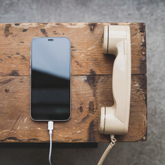 vintage retro and old vs new and modern telephone receiver, phone and smartphone, technology