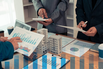 Real estate developers, architects and business teams working on a new business building project in a conference office highlight investment strategies and real estate decisions for future plans.