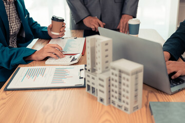 Real estate developers, architects and business teams working on a new business building project in a conference office highlight investment strategies and real estate decisions for future plans.