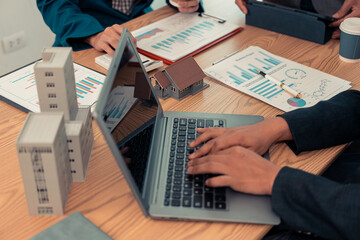 Real estate developers, architects and business teams working on a new business building project in a conference office highlight investment strategies and real estate decisions for future plans.