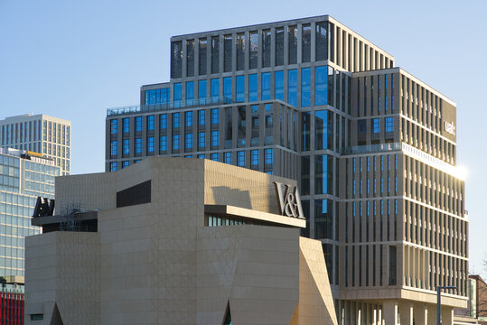 The UAL University of The Arts and London Collage of Fashion campus building with the V and A Museum in Stratford on a sunny day. London - 3rd January 2025