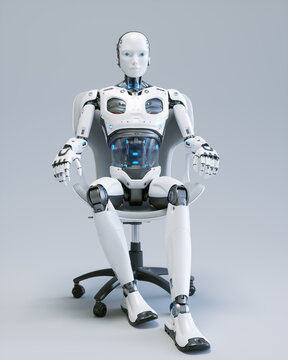 A humanlike robot sits in a chair