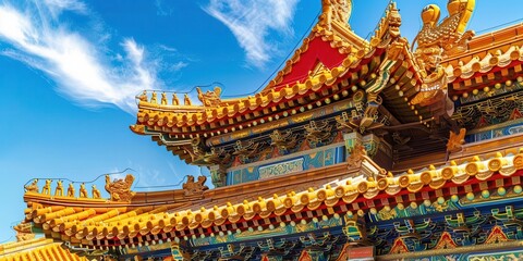 Fototapeta premium Ornate temple roof with vibrant colors and intricate designs against a clear blue sky.