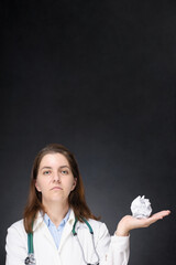 Doctor with crumpled paper ball