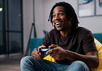 Young man having fun playing video games using wireless controller