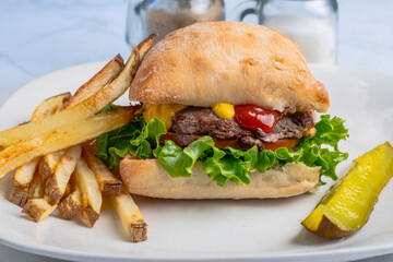 hamburger  top with mustard and ketchup