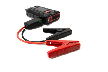 Vehicle battery jump starter. Isolated on a white background. Car, motorcycle, boat, battery, clamp, maintenance.