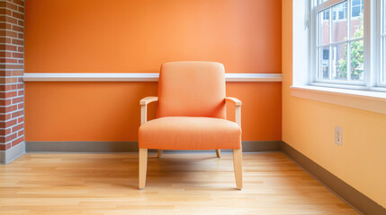 hospital medicine wellness concept. bright orange chair in sunny room with wooden flooring and orange wall