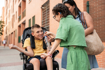 Family bonding with disabled children outdoors, promoting love and care