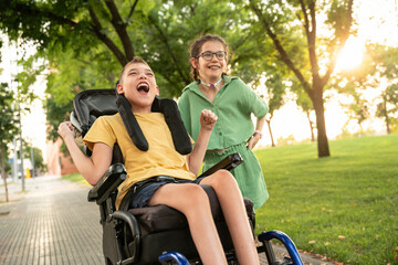 Joyful moment between children friends with disabilities in a park