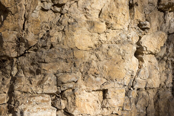 the structure of the surface of natural stone in the canyon of mountain rocks and other stone surfaces in mountainous areas