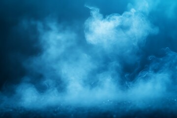 Obraz premium Blue smoke clouds on dark background.
