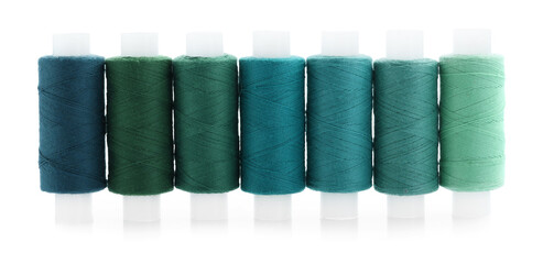 Spools of bright sewing threads isolated on white