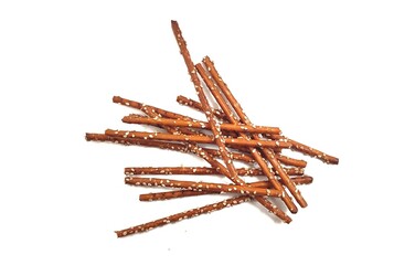 Top view of a pile of crispy salted pretzel sticks, isolated on white background.