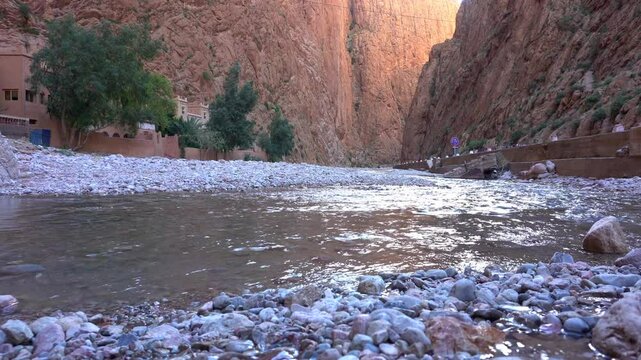 Africa, Tinghir, Morocco,   Todra Gorge of Atlas mountains, People tourists walking between rocky high walls of the canyon ,
Todra and Dades Valley tourist destination sightseeing attraction