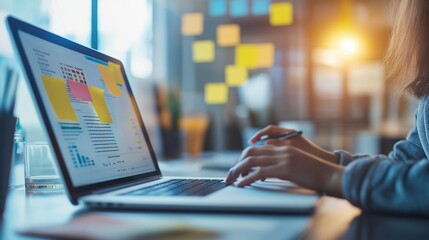 person brainstorming in a modern coworking space, with sticky notes, laptops