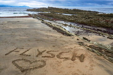 Rocks and flysches of the Bay of Biscay on a cloudy day. Basque country