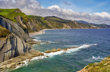 Scenic view on the beach of the Bay of Biscay on a cloudy day. Zumaia, the Basque country, Spain