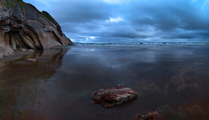 Cloudy evening on the beach of the Bay of Biscay, the Basque country